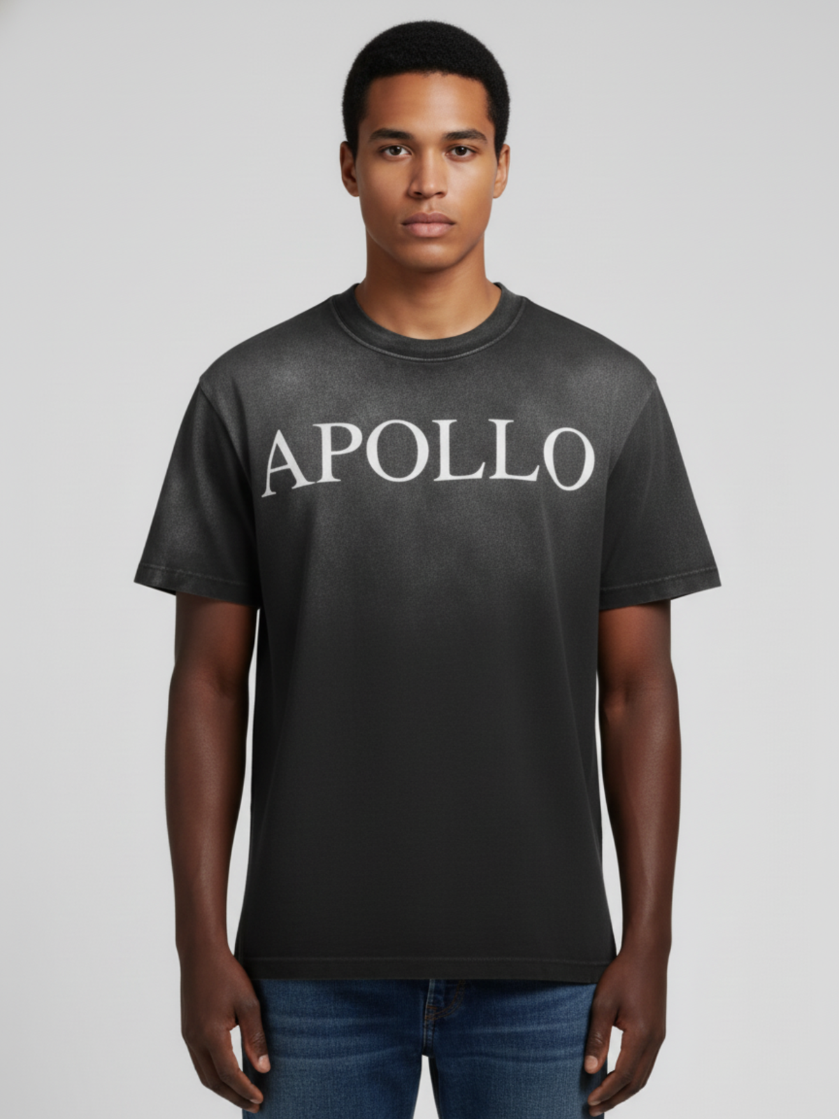 Man wearing a black t-shirt with 'APOLLO' text on a plain background