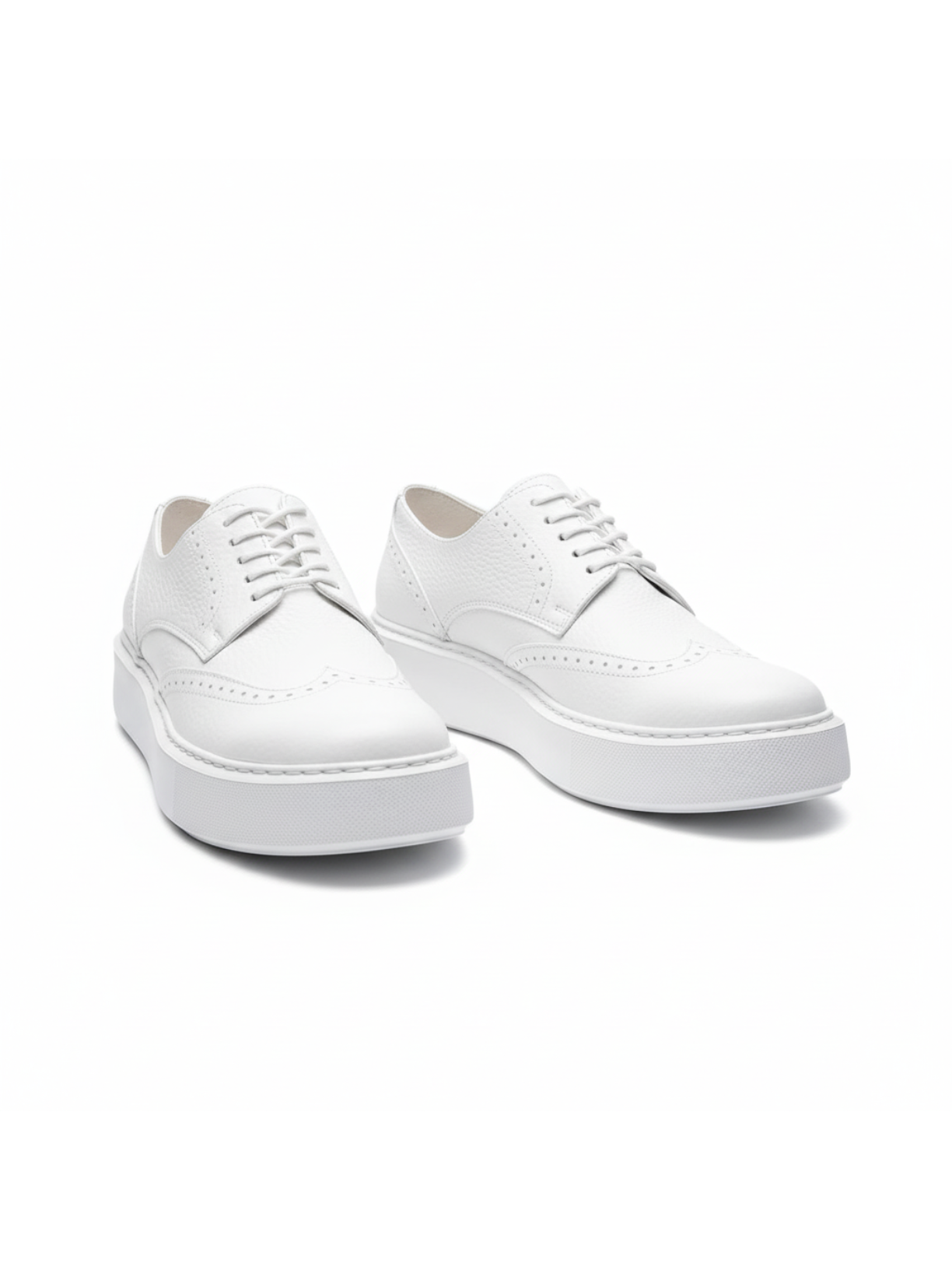 Pair of white sneakers on a white background