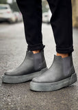 Close-up of Avalon Noir Essence charcoal Chelsea Apollo boots with matte gray sole.